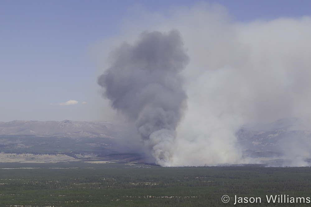 A Giant Plume Of Smoke Is Seen On The Yellowstone National Park Landscape As The Maple Fire Burns