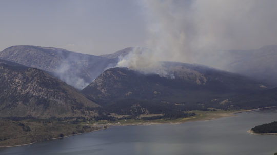 A Plume Of Smoke From The Berry Forest Fire In Grand Teton National Park Can Be Seen Rising Above The Lake