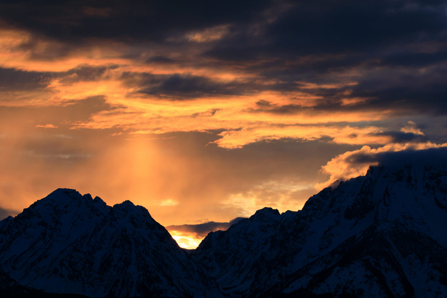 The Setting Sun Flares Bright Orange Amidst Smoke From Fires On The Idaho Side Of The Teton Mountains