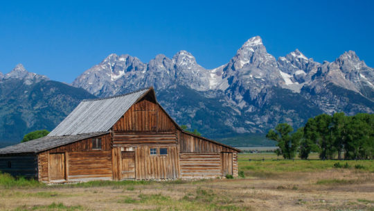 The Historic Moulton Barn Is Seen Against The Backdrop Of The Grand Teton Range in Jackson Hole Wyoming