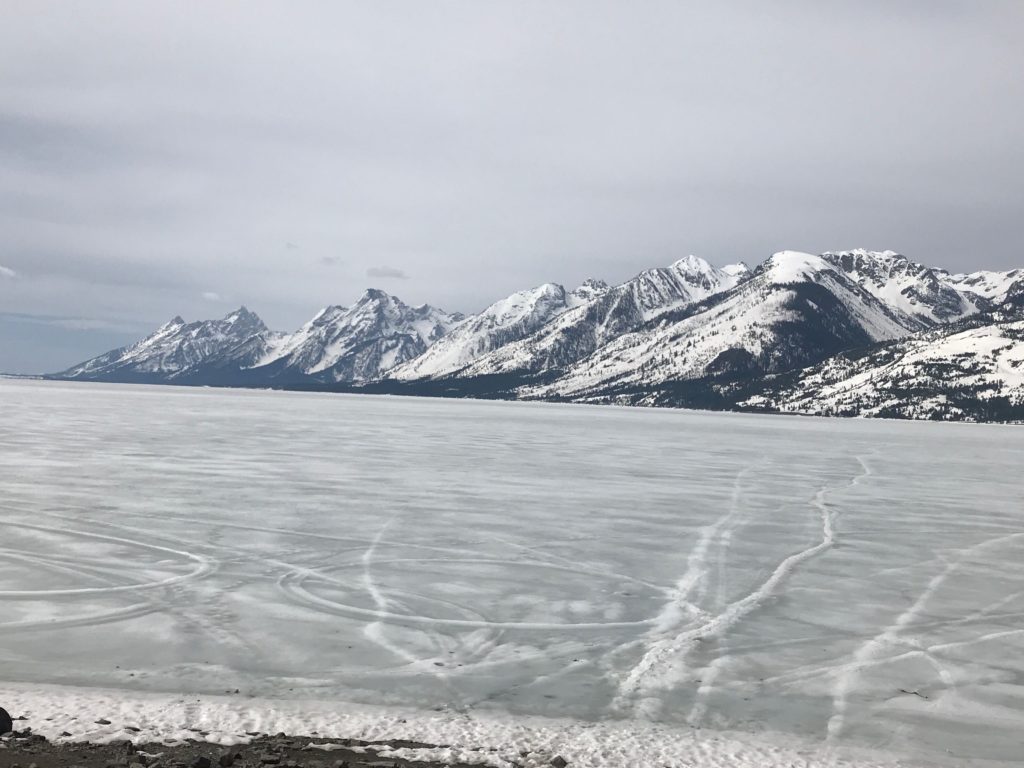 Beautiful mountains surrounding icy lake