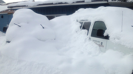 A Winter Snow Storm Buries A Jackson Hole Wildlife Safaris Van In The Parking Lot